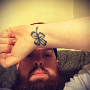 The original tattoo was the area code of the state of Rhode Island and the cover-up is supposed to be a four leaf clover