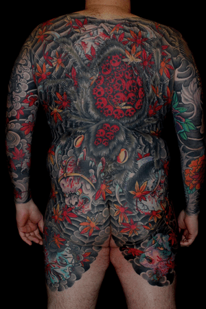 Intricate Japanese design featuring a spider, flower, skull, namakubi, and blood by renowned artist Stewart Robson.