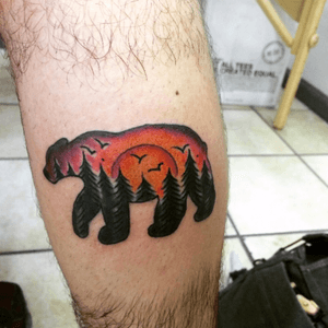 Boyfriends new tattoo. He has a lot of catching up to do 👍💋done by Lenny Sandvick at Hero Tattoo #bear #beartattoo #sunset #sunsettattoo #forest #traditional #pinetree #thewoodsismylife #nature #naturetattoo #color #bird #birdtattoo #professional 
