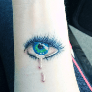 Recently touched up, still healing eye tattoo by Angelina Sweeney DeMarcus at 18th st tattoo in Eugene, Or #eyetattoo #realisticeye #cryingeye 