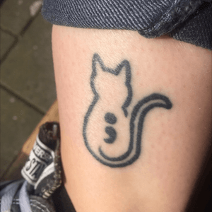 This is a tattoo I got for the #semicolonproject, because I have been struggling with depression for several years. This reminds me that I've strong enough to go on. I added the #cat outline because I wanted something more custom than just the #SemiColon and I really love cats. Done by Ernesto Visser at Fearless in The Hague