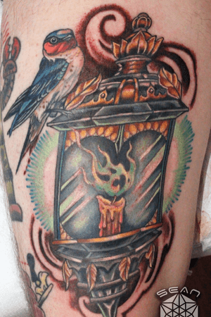Custom #lantern #bird #candle #flame #fire #candlelight #lamp tattoo by Sean Ambrose at Arrows and Embers Tattoo in Concord, NH. Thanks for looking! #tattoooftheday