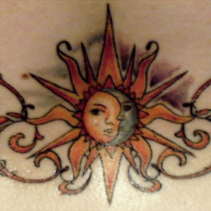 My 6th tattoo done in 2011. Located across my lower back. #sunandmoon #sun #moon 