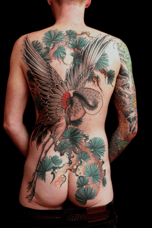 Elegant and traditional Japanese crane motif beautifully rendered in Stewart Robson's signature style on your back.