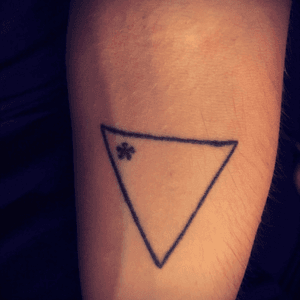This was my first tattoo - it is a symbol I designed to represent the beauty and strength of the transgender community (I am a proud trans guy) as well as my place in it's history. From Golden Rule Tattoo in Phoenix, AZ