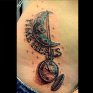 Right hip tattoo reminding that with time all wounds heal