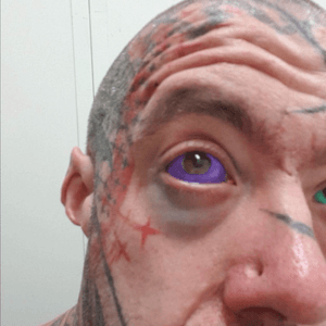 Purple eyeball tattoo