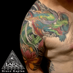 Tattoo by Lark Tattoo @larktattoo artist/owner Bruce Kaplan. .#tattoo #tattoos #tat #tats #tatts #tatted #tattoist #tattooed #tattoooftheday #tattoooftheday #amazingink #tattooig #tattoosofinstagram  #larktattoo  #dragon #dragontattoo #lotus #lotustattoo #japanesetattoo #japanesetattoos #colortattoo #colortattoos #halfsleevetattoo #armtattoo #armtattoos #chesttattoo #chesttattoos