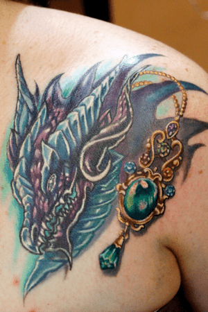 Custom #dragon and #pendant #gem #necklace tattoo by Sean Ambrose at Arrows and Embers Tattoo. Thanks for looking!