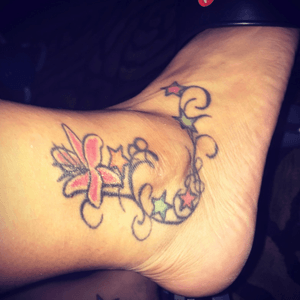 Wedding tattoo after my big day. Has all my family first letter of our names. And my star lilys of my wedding bouquet.
