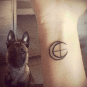 This is my first tattoo whith my dog Joy !This is the astronomical symbol of the moon and earth. 