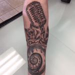 Microphone,roses and a timepiece done by Chris MacCharles 