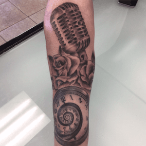 Microphone,roses and a timepiece done by Chris MacCharles 