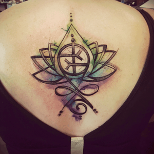 My latest tatto that i designed myself. Its a combo of my sons birth flower, empath symbol and symbol for inner strength. It also has 11 dots because i always see 11:11 on the clock. 