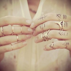 More finger tattoos