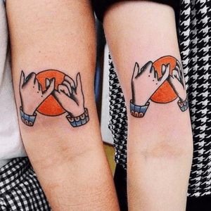 Matching tattoos amounst friends or family, or a solo tattoo. Crossed figures representing a union or promise. (This is not my tattoo)