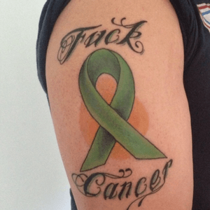 I got this tattoo to support my wife who was diagnosed with lymphoma & beat it! She is now 2 years in remission & 100% cancer free! #FuckCancer 