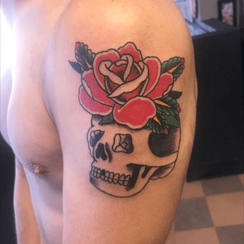 traditional rose and skull tattoo