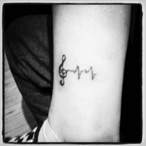 This was my forst tattoo when i was 15. It means music will never leave and its brings light into peopels soul and it saves you. Music saves.