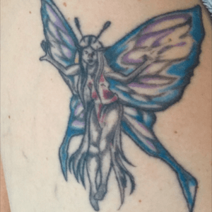 I need help with a great idea for a cover up. My fairy has no hand, shapless body and blended outline to her hair. I love bright colored femine tattoos