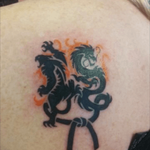 The tiger represents my eldest son the dragon my youngest tied together with my black belt our family
