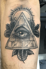All seeing eye on left elbow