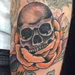 Skull and rose right under an elbow. He wanted orange. 