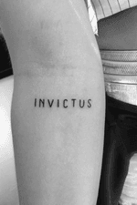 Script on forearm #invictus 
