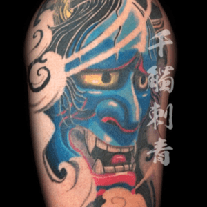 Blue Hannya mask and clouds.  Tattooed by Oliver Wong