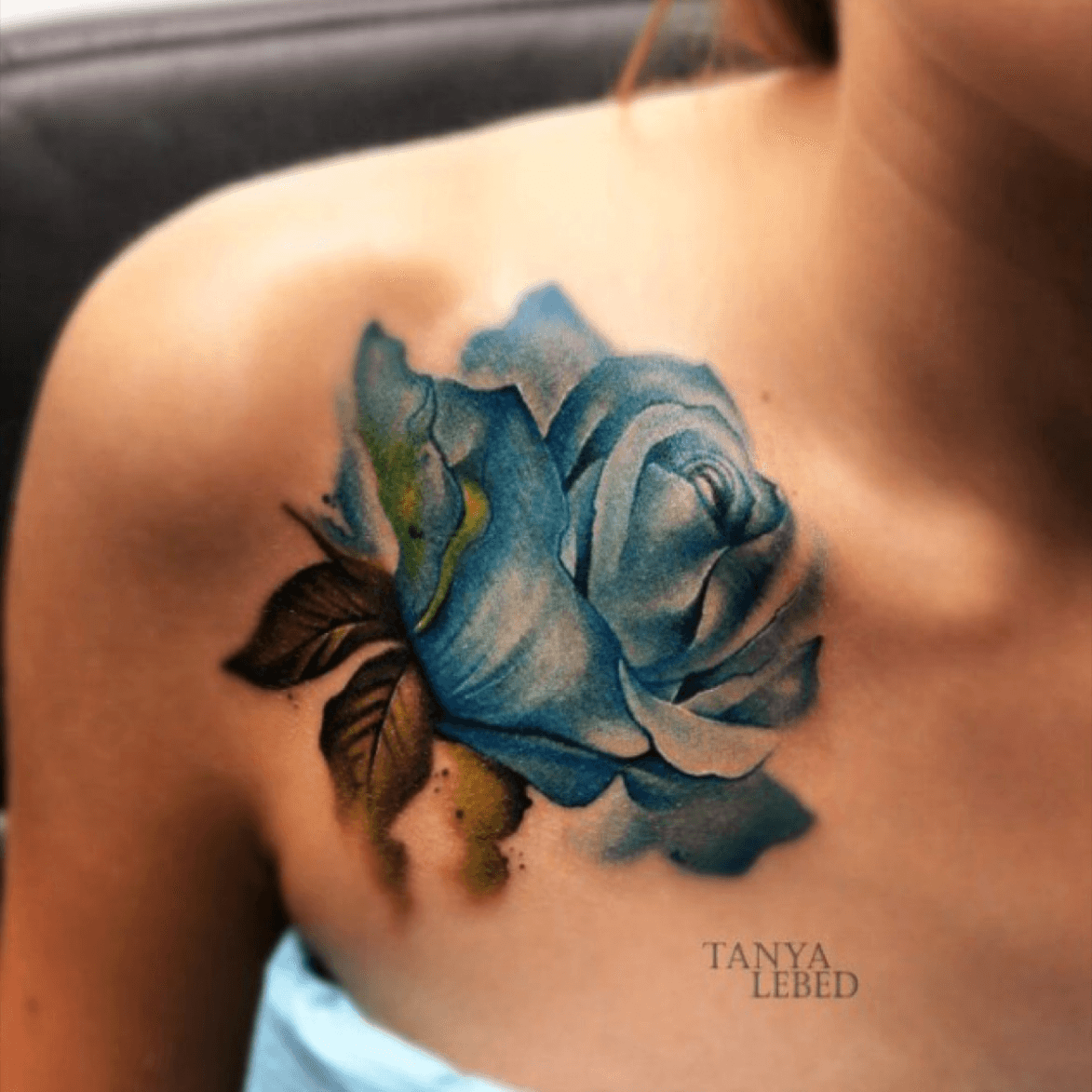 blue roses tattoo on chest