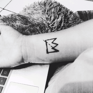 Basquiat crown tattoo