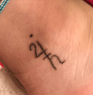 Jupiter/Saturn symbols on the ankle