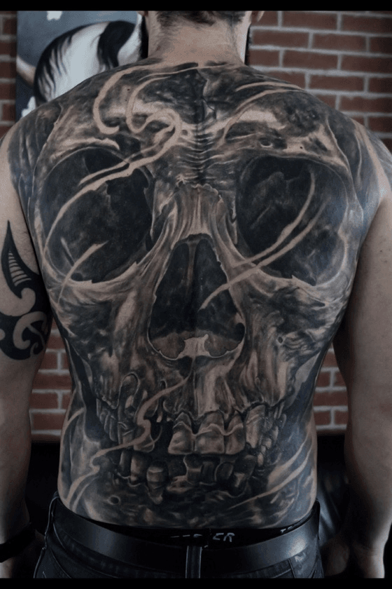 Amazing skull tattoo on full back by Zak Schulte