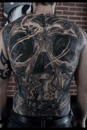 Full back skull tattoo by Tim