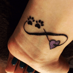 Small cute tattoo that I got with my Mum #jointtattoos #motheranddaughter #infinity #heart #paw #wrist #smallinkwork #purple #black