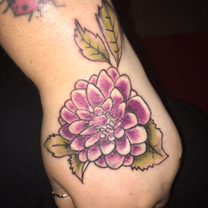 This tattoo was done in memory of my granparents. It is an edinburgh dahlia flower which my grandparents grew and sold when they were alive