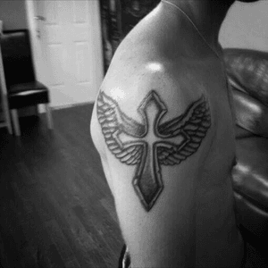 My first tattoo #cross #wings #shoulder #black 