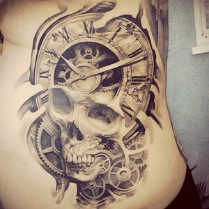 Another time piece! #artistunkown #skull #clock #cogs #death #rippedskin #blackandgreytattoo #blackandgreyportrait #abstract #epic #awesome #realistic #ribs 