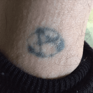 Anarchy tattoo done with homemade tattoo machine when I was 17. I'm 50 now. This was my only tattoo until I had it added to...