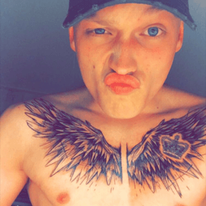 Sketched wings on chest 