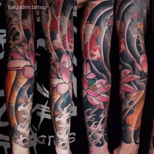 Japanese full sleeve. Goldfishes and Lotuses tattoo.