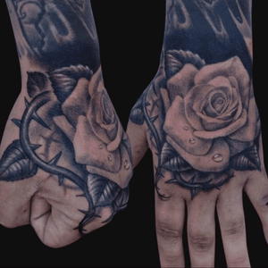 Beautiful thorn and rose hand tattoo #hand #rose #thorn 