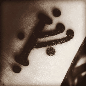 Thief's mark from the Hobbit. It's a subtle way to scream your nerdiness. 