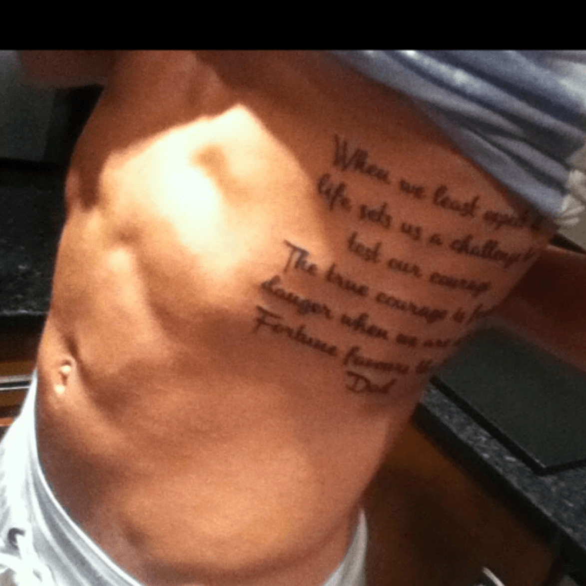 cursive tattoo ribs