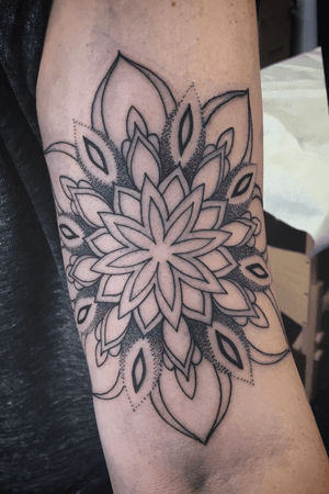 A mandala done by alex, who specializes in linework and dotwork