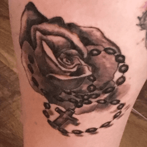 A rose for my daughter and the rosary my Nan carried with her when she travelled for over 40 years. Done by Robert Gibson of Gibson Ink