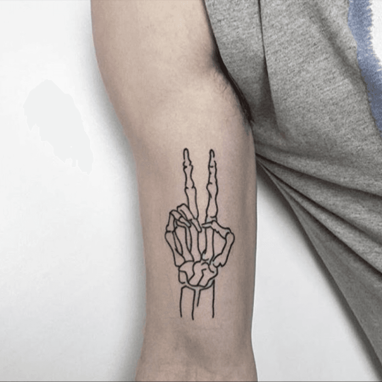 Peace Symbol In Small Daisy Tattoo On Back Leg