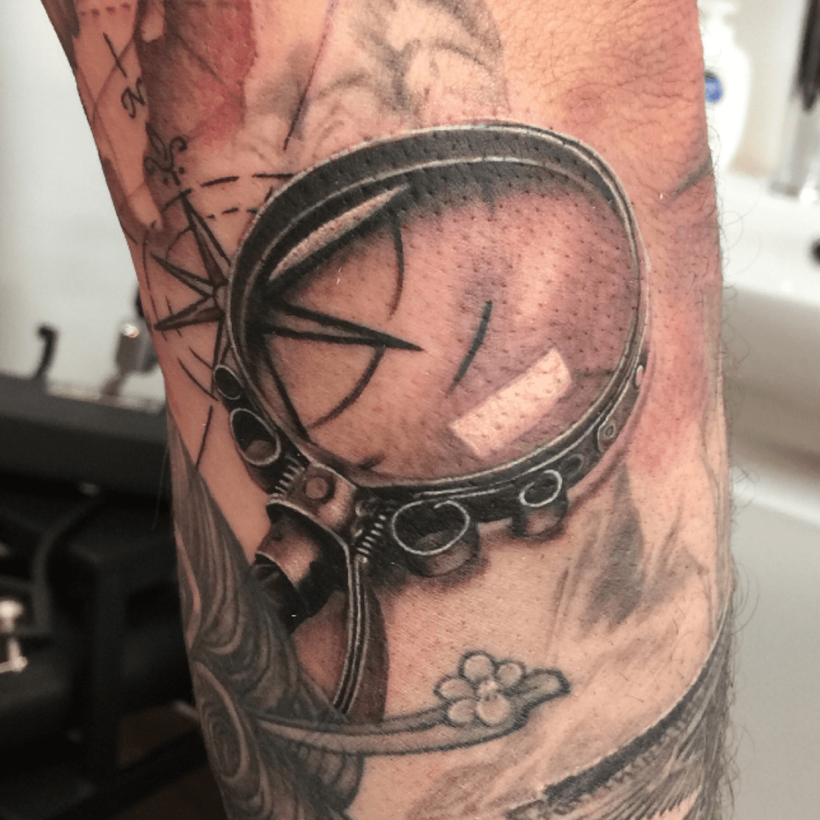 traditional magnifying glass tattoo
