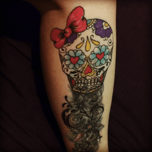 This is my leg tattoo the tattoo shop i went to actualy messed up the flowery bit but i had a lady come over to my house and fix it with shading and a candy skull could use alot more work!