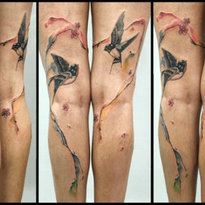 In love with this tattoo ..It has my favourite swallows , cherry blossoms, a heart around the birds with splash of colors.#tattoo #swallows #tattoo 